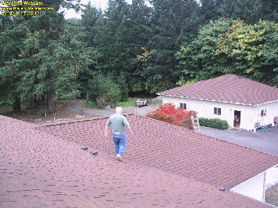 Camera took picture of me walking on our roof after making adjustments to enclosure of new Cam