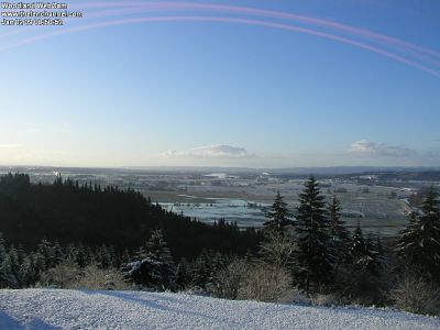 Snow here with a lot of rain in the valley.  The pink arcs on the top of the picture is the path of the sun where it burned the CCD in the camera.